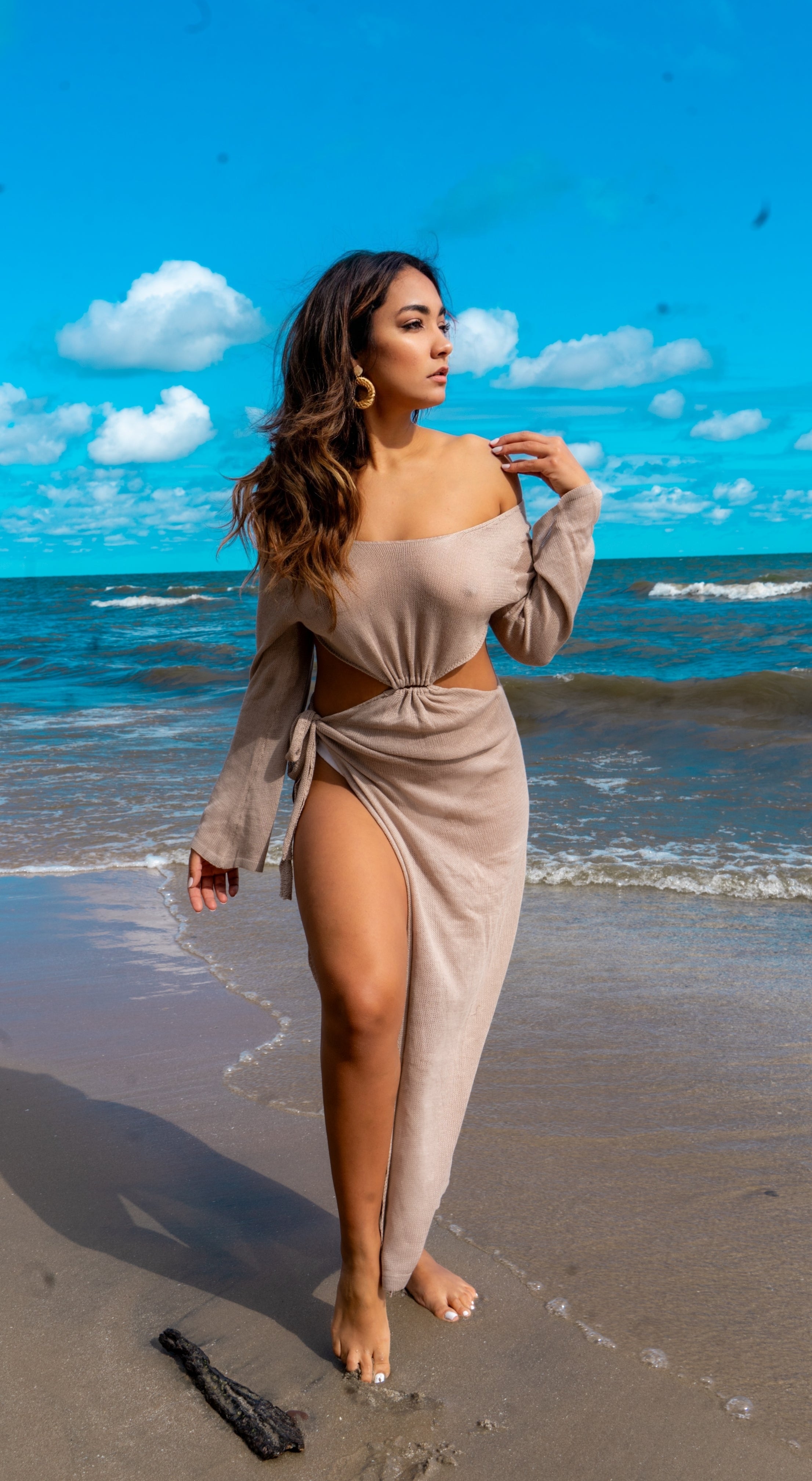 Beige beach cover-up made of 100% polyester with long sleeves. This cover-up open at the back with ties at the upper back and at the waist. This beautiful Cover Up has a leg opening that makes it look attractive.