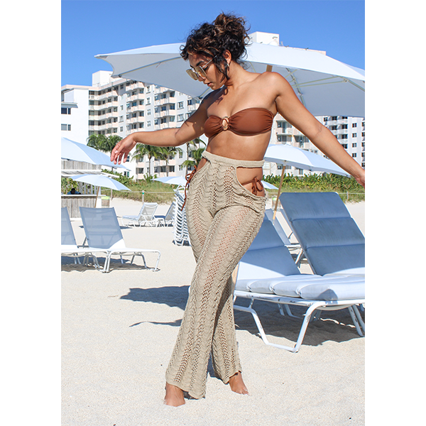 Beach cover up crochet pant made of 100% Polyester. This cover up pant is color Khaki. This pant has two opening in each side of the hip that make it looks attractive and is perfect for the beach.